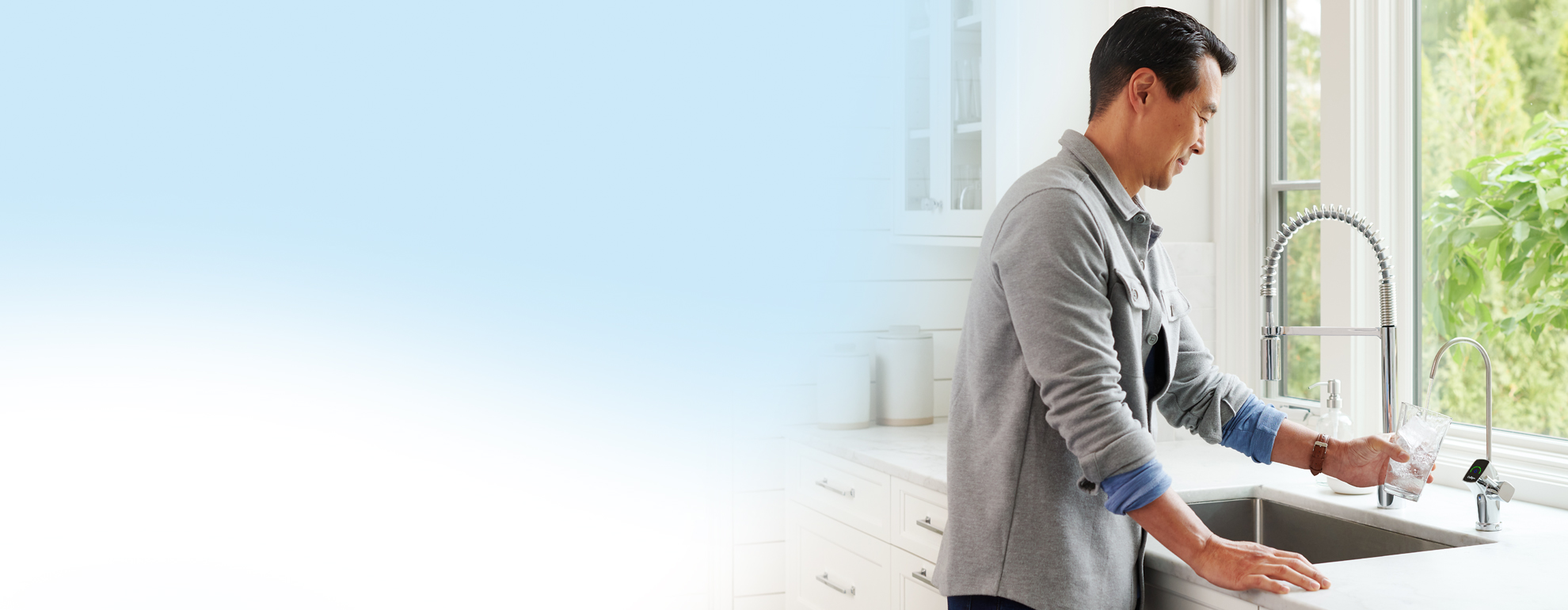 man filling his water cup